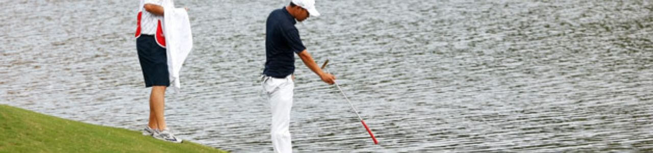 Golfer Retrieving Golf Ball
