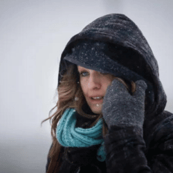 Girl in harsh weather wearing cold weather gloves