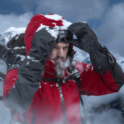 Man in Arctic weather wearing extreme cold weather gloves