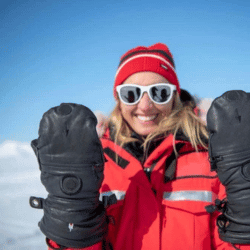 Woman showing her extreme cold weather gloves
