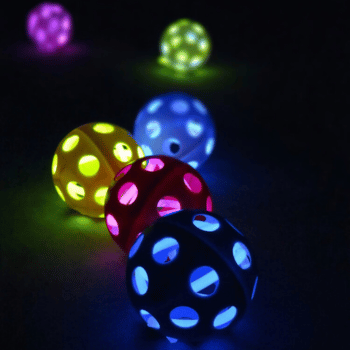 Six different colored glow-in-the-dark wiffle balls