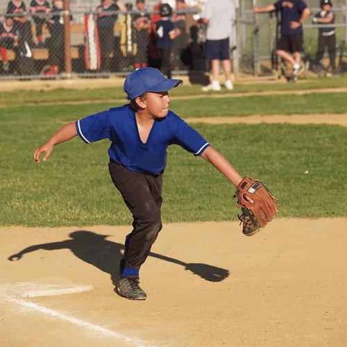 Little leaguer playing first base