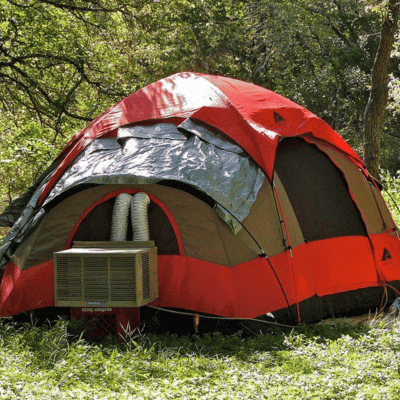 Portable tent air conditioner attached to a tent from the outside