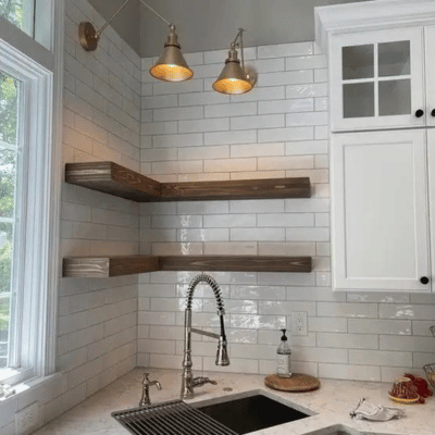 Floating wood shelves installed in the kitchen corner
