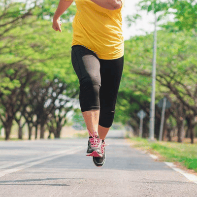 Woman running in running shoes for overweight women