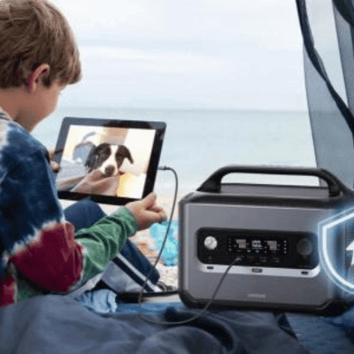 Portable power station powering a boy's tablet