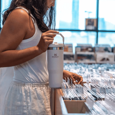 Woman holding a Stanley stainless steel water bottle