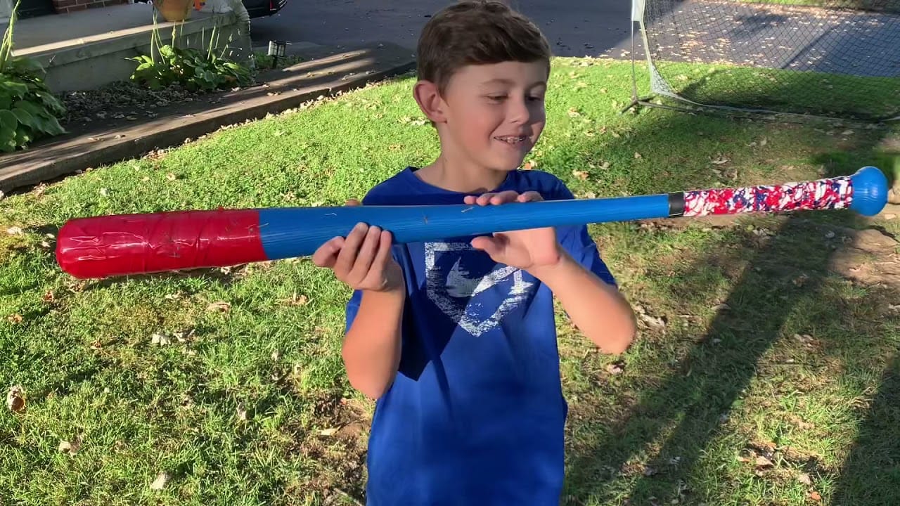 Boy admiring his corked wiffle ball bat