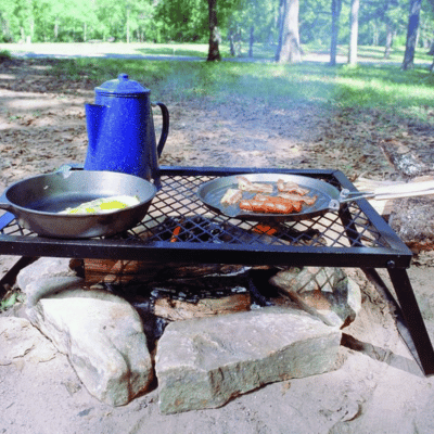 Using campfire cookware on a grate over a fire