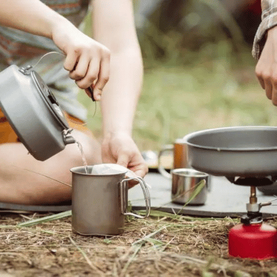 Campers using campfire cookware