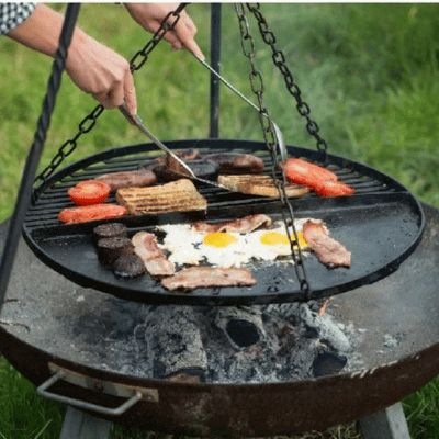 Person using campfire cookware