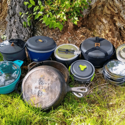 Several pieces of campfire cookware