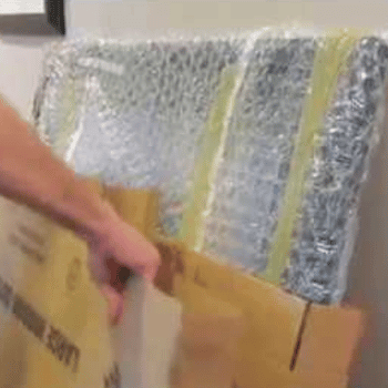 Packing a wrapped mirror