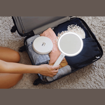Carry-on luggage with a travel mirror