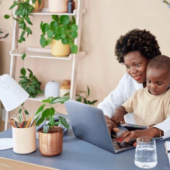Woman working from home with a baby in her lap