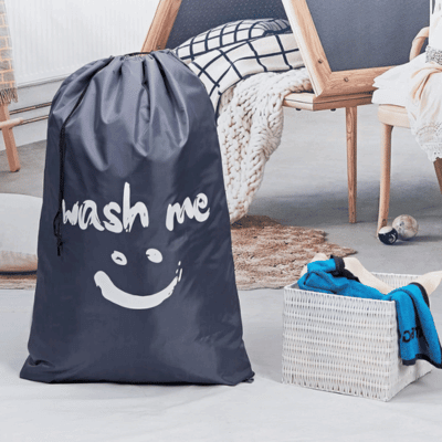 Gray laundry bag ready for a trip to the laundry