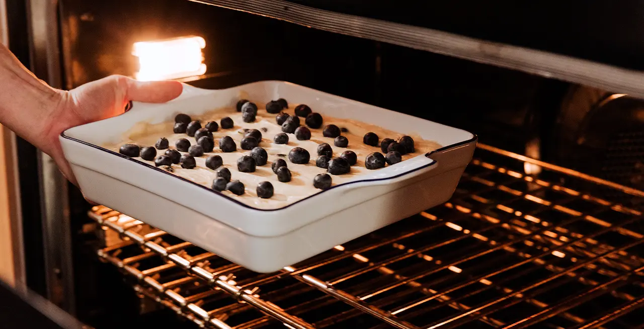 Ceramic baking dish put in a hot oven