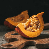 Pumpkin slice with raw pumpkin seeds