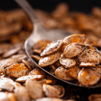 Spoonful of baked pumpkin seeds