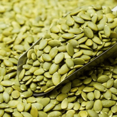 Snow white pumpkin seeds without shells in a scoop