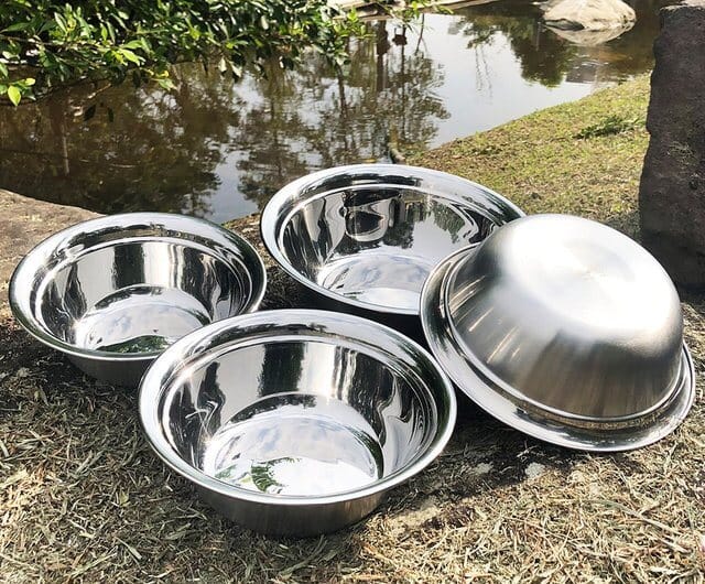 Set of stainless steel bowl in a backyard setting