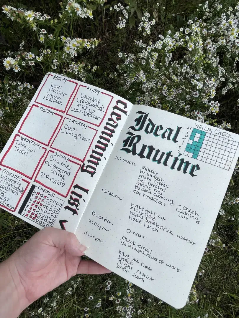A person using a bullet journal habit tracker for ADHD
