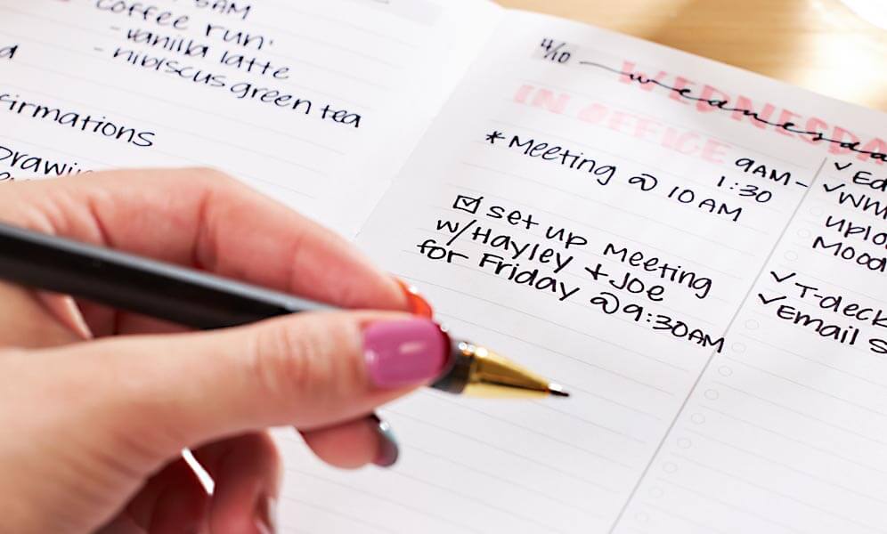 A person using an ADHD bullet journal to record ideas