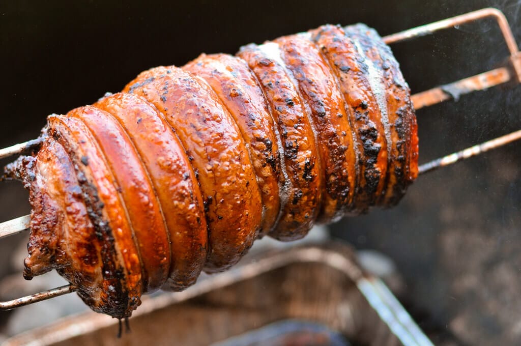 A spit roasted pork shoulder