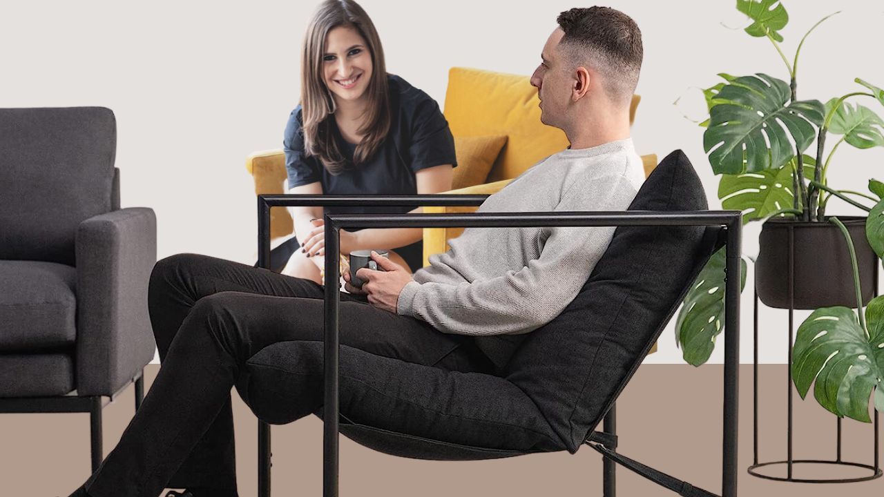 Two People Sitting In Accent Chairs