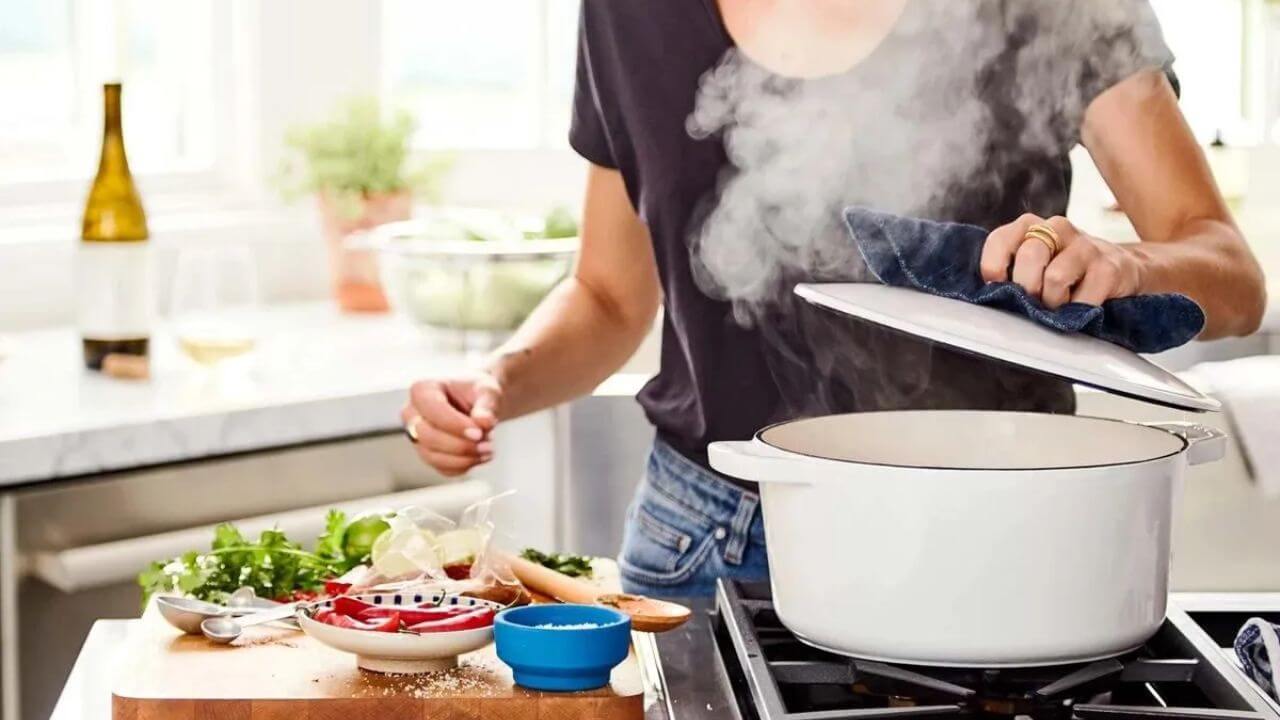 Women cooking with a Dutch oven