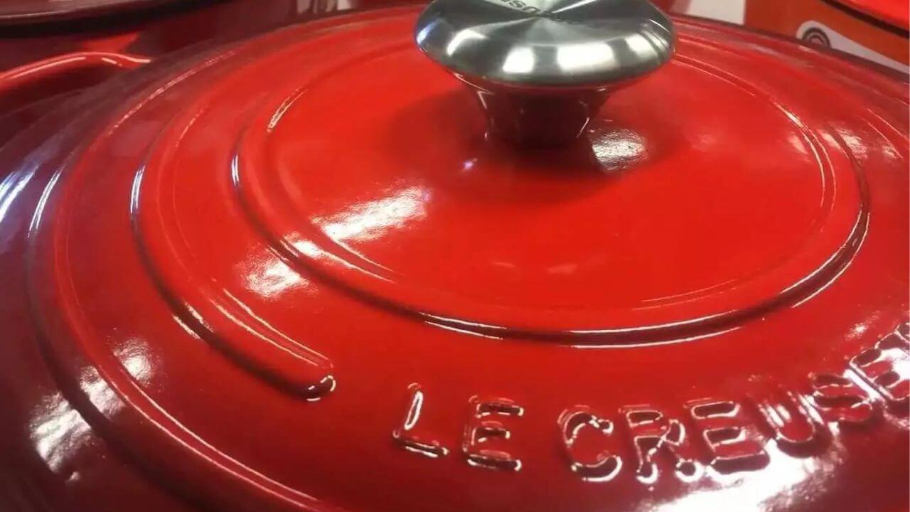 Le Creuset's name stamped on the red Dutch oven lid