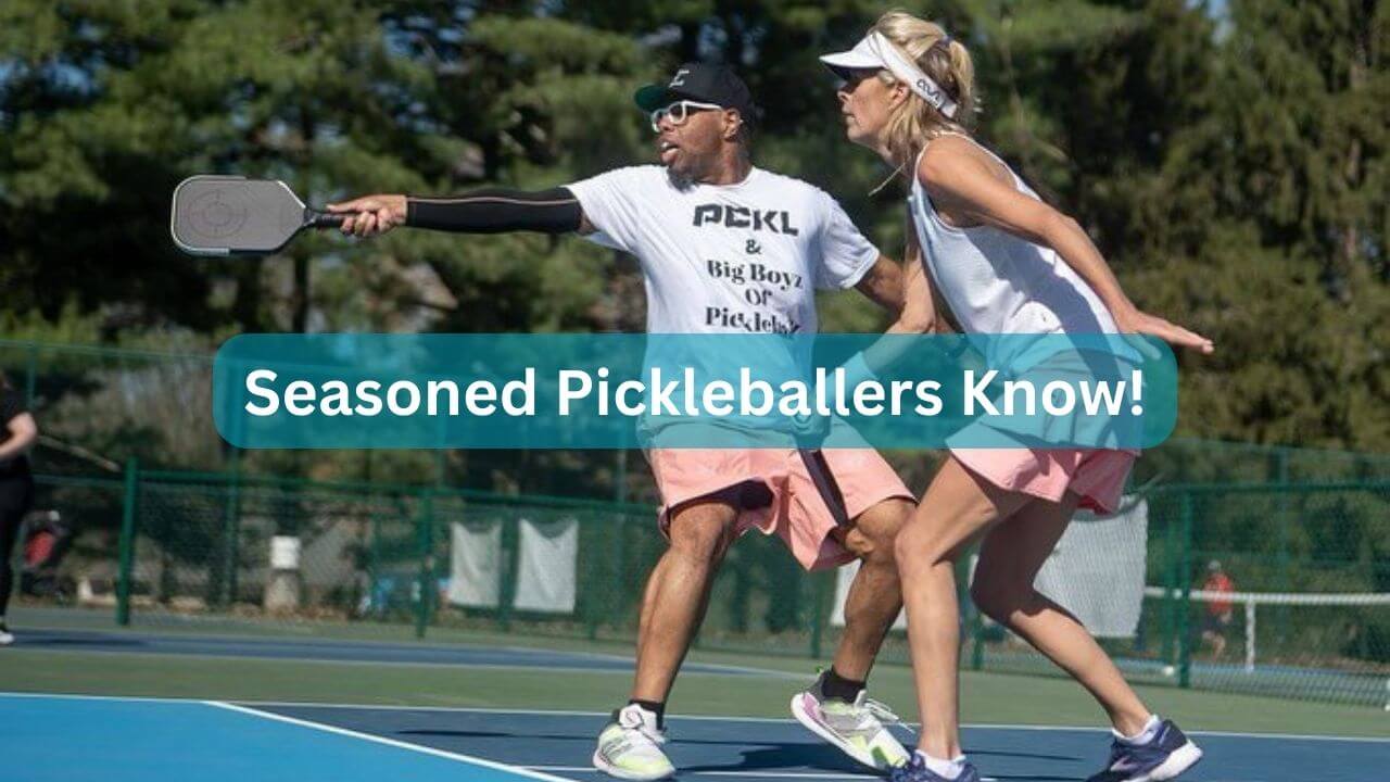 A man and woman seasoned pickleball players in tournament action