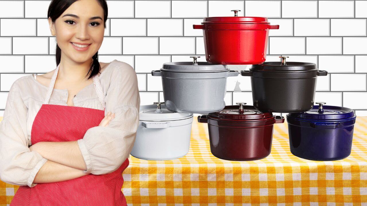 Woman showing pride while standing in front of her Staub Dutch oven collection on a table
