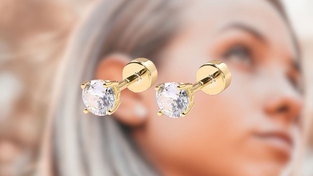Pir of flat back earrings with a woman in the background