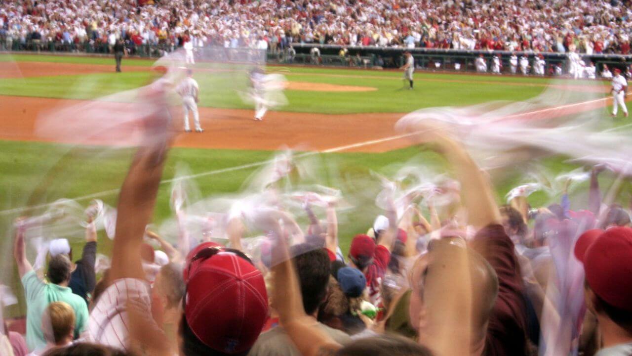 Crowd waving rally towels at a baseball game