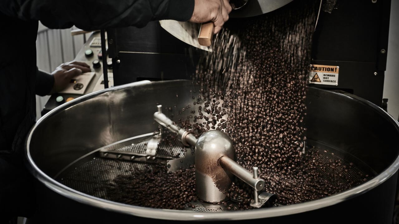 Coffee roaster with dark roast coffee beans