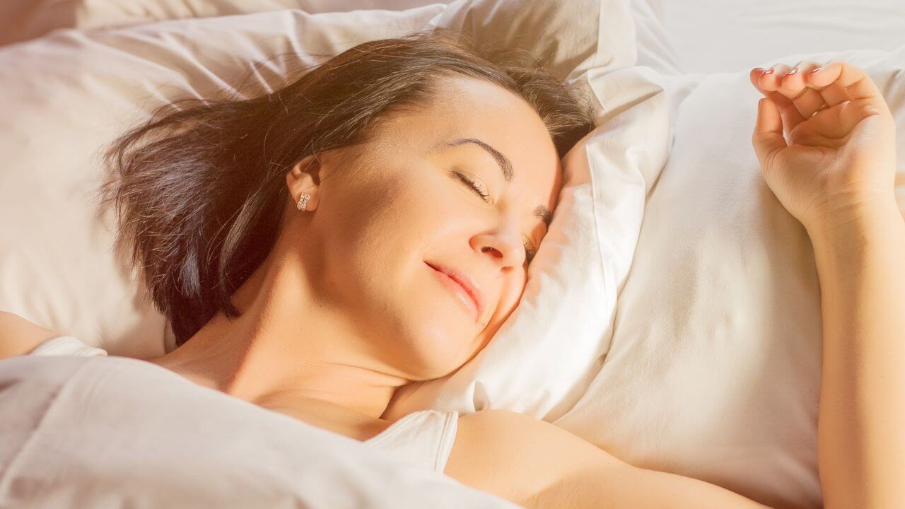 woman sleeping with flat back earrings