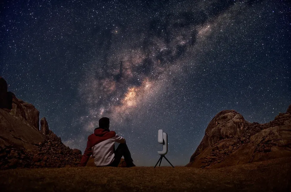 Man using a smart telescope to view the deep-sky