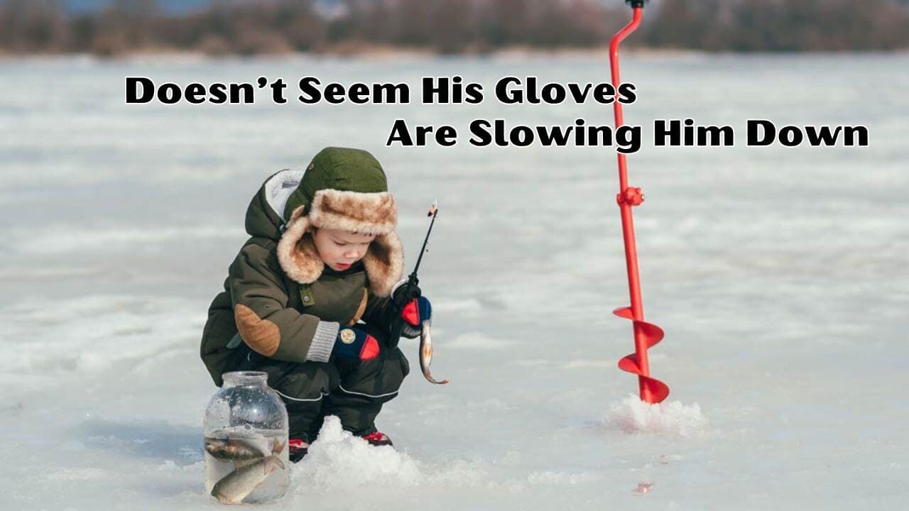 Boy showing his dexterity as he ice fishes with gloves