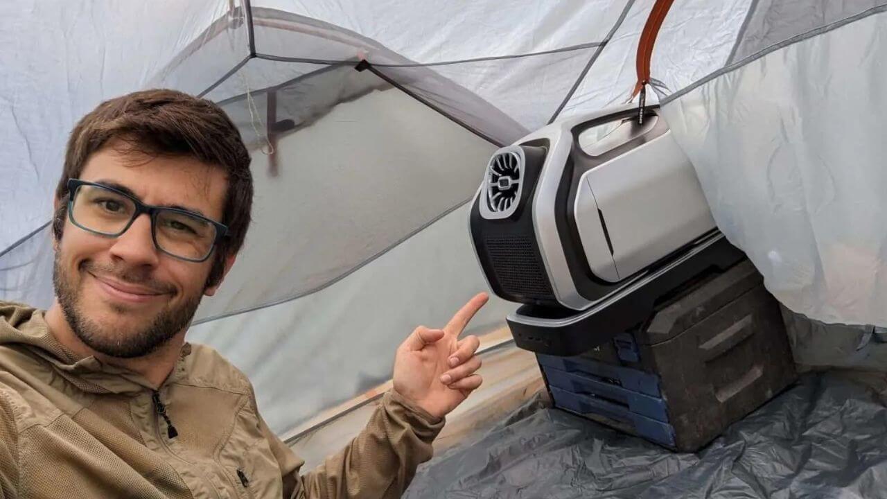 Man showing that air conditioners for tents do exist