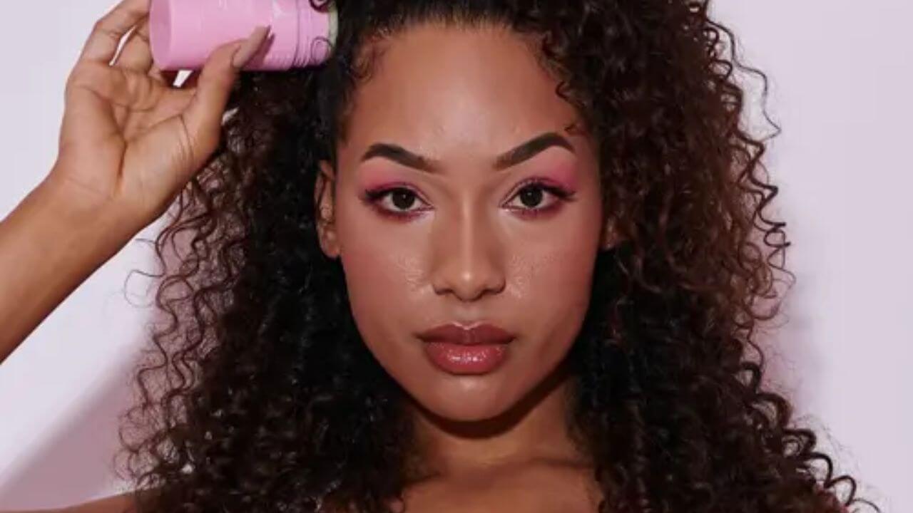 Woman using a hair wax stick