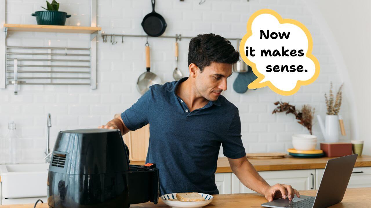 Man getting instructions on how to preheat a CRUX air fryer