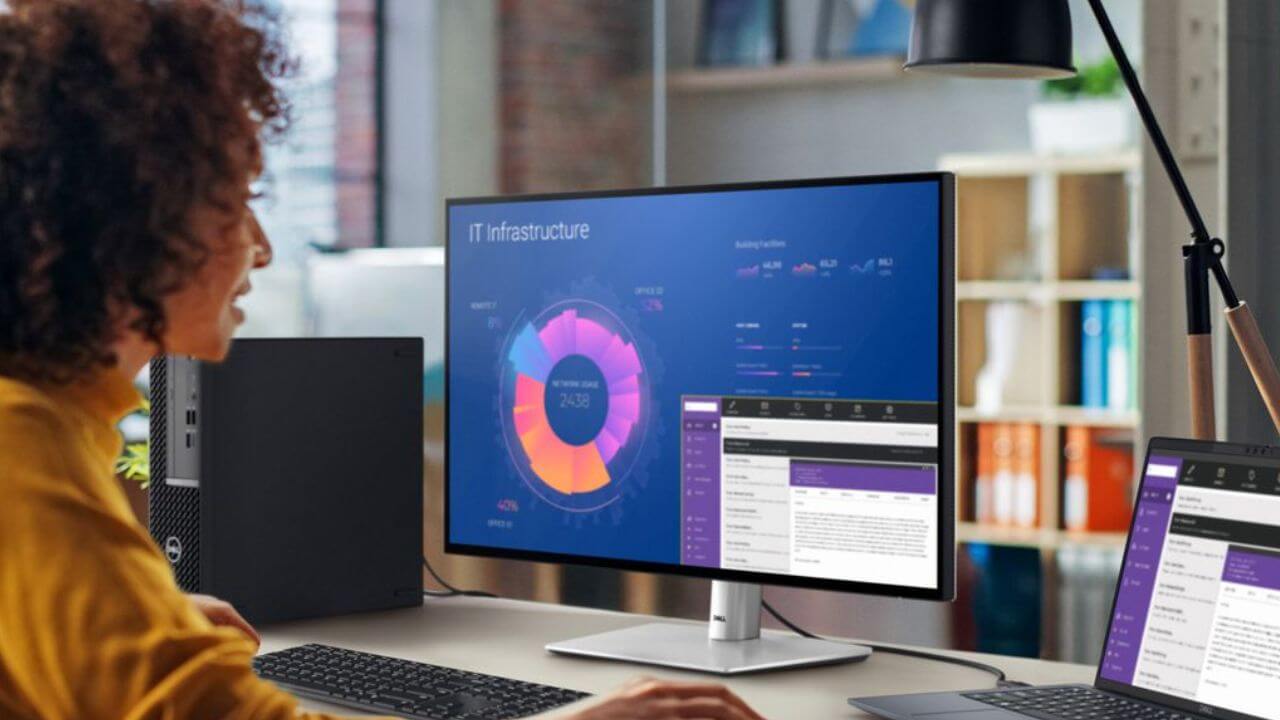 Woman doing productive work on an OLED computer monitor