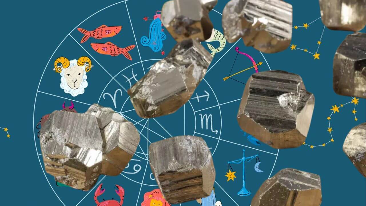 Pyrite crystals and stones in front of a zodiac chart