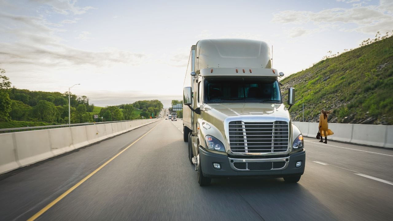 Truck dash cam inside the cab of a truck on the highway