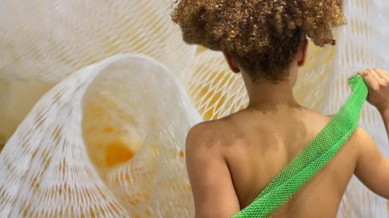 Woman using an African Net Sponge