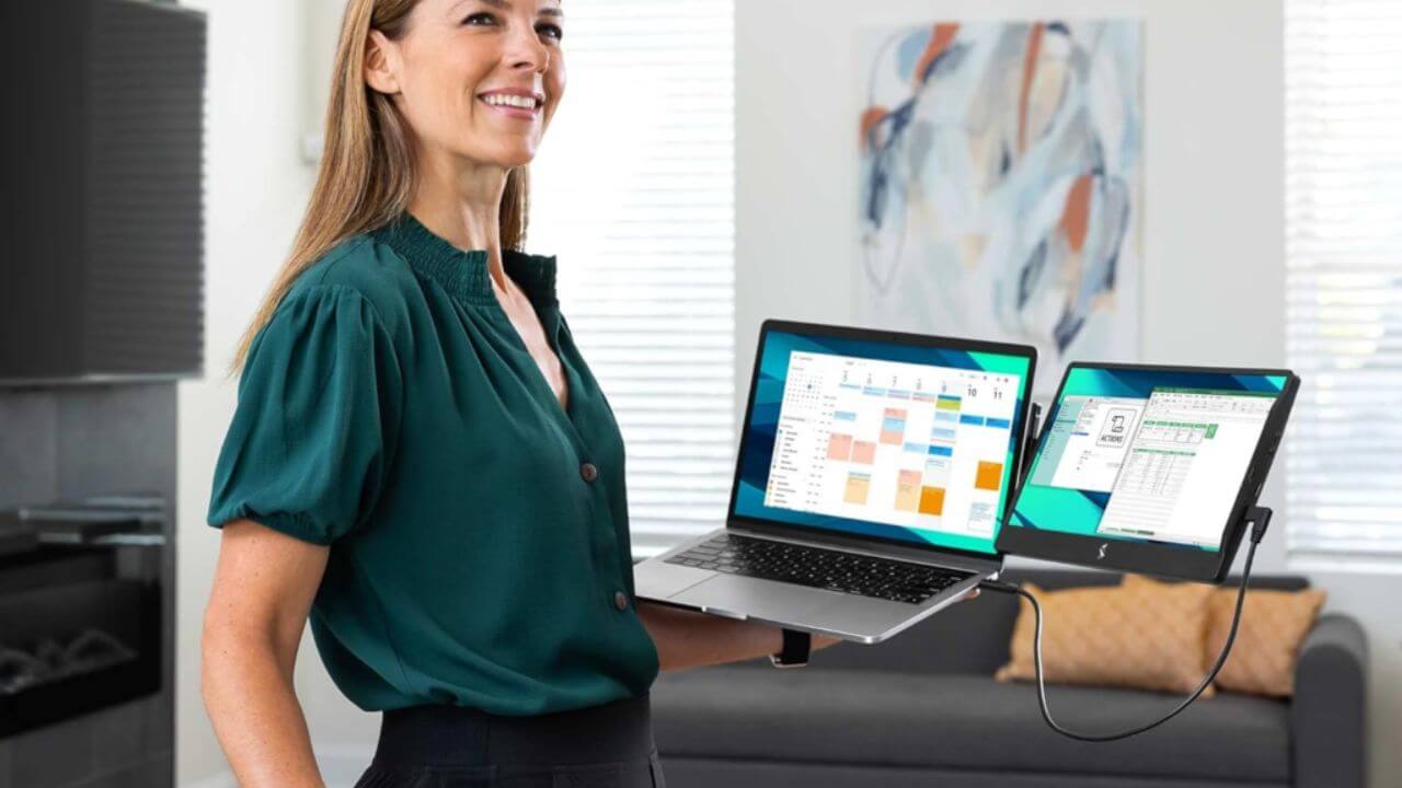 Woman proudly displaying her laptop with a screen extender