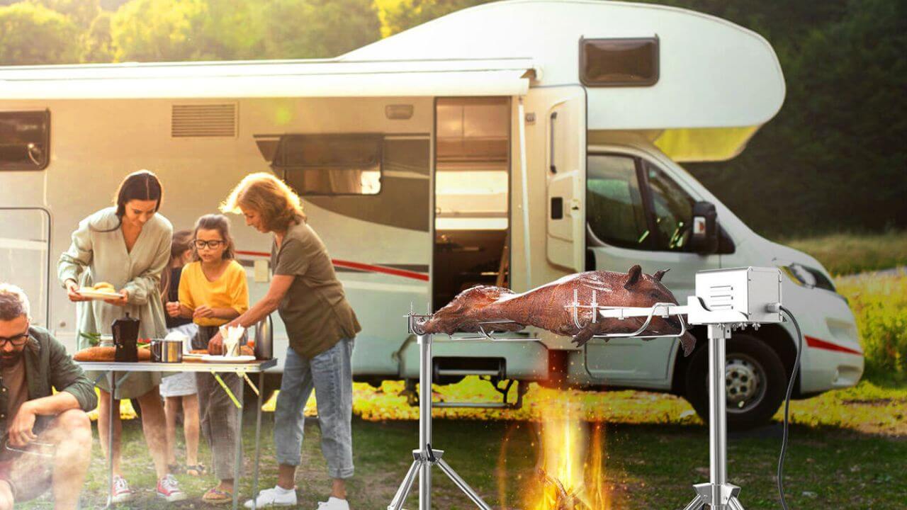 A group of people enjoying a spit roasting event while on an RV adventure