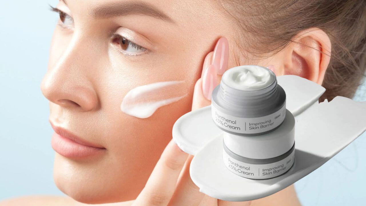 Woman rubbing penthenol cream on her face to achieve radiant skin